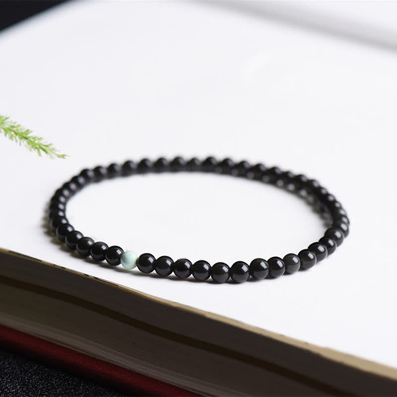 Buddha Stones aus schwarzem Obsidian und Türkis – Symbol für Stärke und Erfüllung - image 3