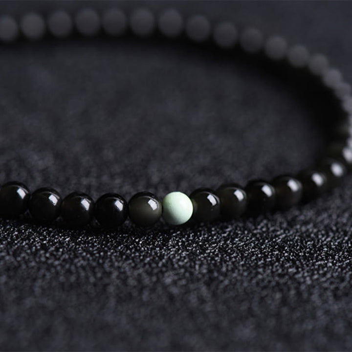 Buddha Stones aus schwarzem Obsidian und Türkis – Symbol für Stärke und Erfüllung - image 4