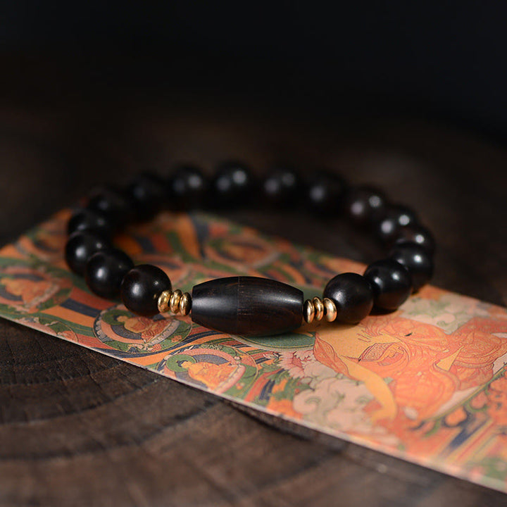 Buddha Stones, Ebenholzperlen mit Sutra-Schriftrolle, Segens- und Schutzarmband - 16-17 cm - image 0