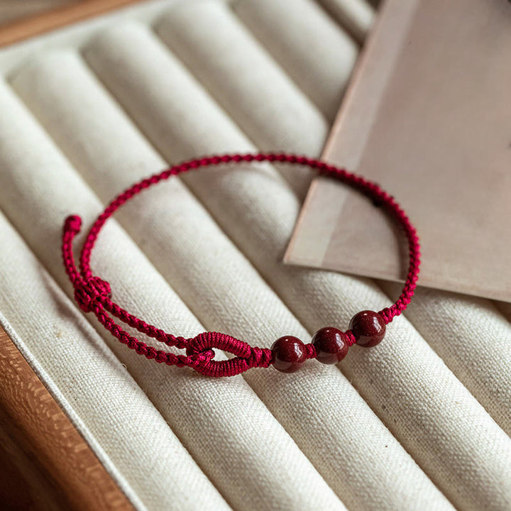 Buddha Stones Handgefertigtes Armband aus geflochtenem Seil mit Zinnoberperlen und dem Spruch „Ruhe und Segen“. - Dunkelrotes Seil (Handgelenkumfang 16-18 cm) - image 0