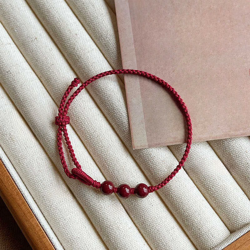 Buddha Stones Handgefertigtes Armband aus geflochtenem Seil mit Zinnoberperlen und dem Spruch „Ruhe und Segen“. - image 2