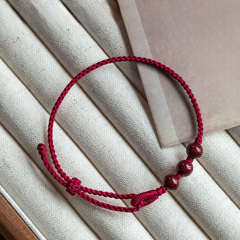 Buddha Stones Handgefertigtes Armband aus geflochtenem Seil mit Zinnoberperlen und dem Spruch „Ruhe und Segen“. - image 1