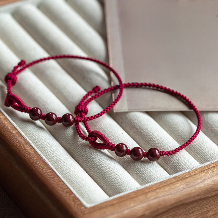 Buddha Stones Handgefertigtes Armband aus geflochtenem Seil mit Zinnoberperlen und dem Spruch „Ruhe und Segen“. - image 4