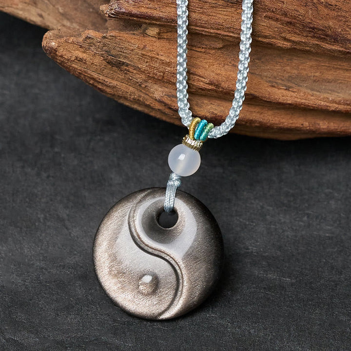 Buddha Stones Halskettenanhänger aus Obsidian mit Yin-Yang-Symbol und silbernem Schimmer - image 1