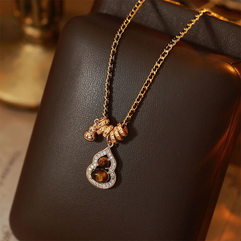 Buddha Stones Doppelkürbis-Tigerauge-Anhänger aus kupferplattiertem Gold - Tigerauge (Größe: ca. 3 x 1,4 cm) - image 0