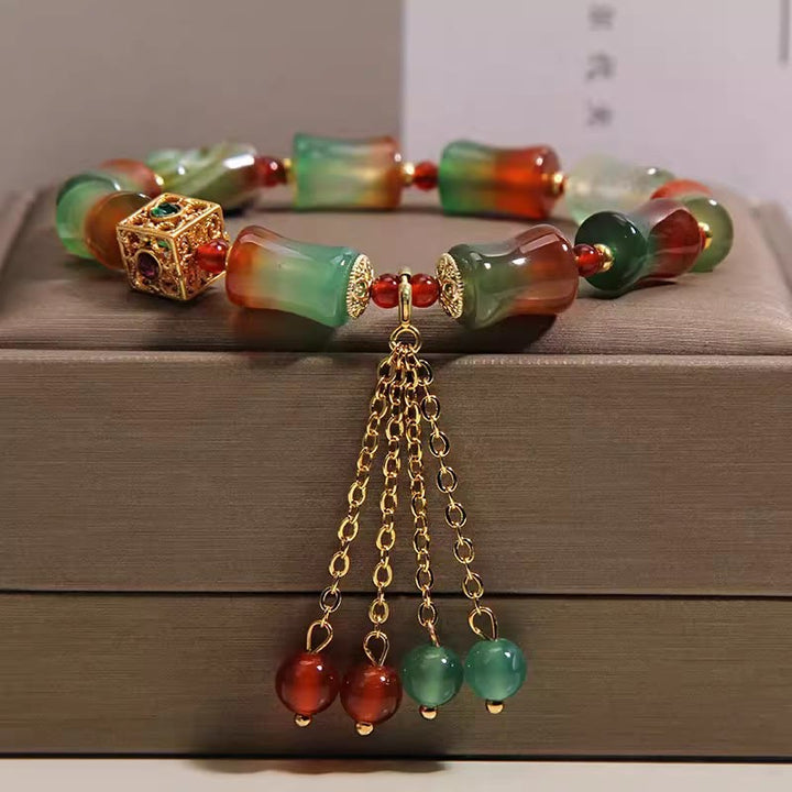 Buddha Stones Buntes Armband aus Pfauenachat-Bambusperlen mit Quaste – Mut-Armband - Pfauenachat (Handgelenkumfang 14-16 cm) - image 0