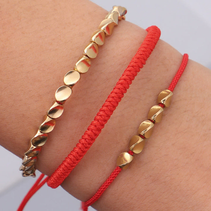 Buddha Stones 3-teiliges Armband aus goldenen Kupferperlen und roter Schnur - image 9