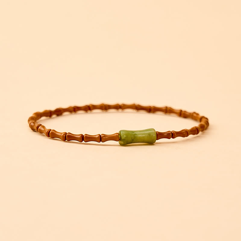 Buddha Stones Armband aus natürlichem Olivenkern, Peridot und Bambus im Schutzdesign - image 4