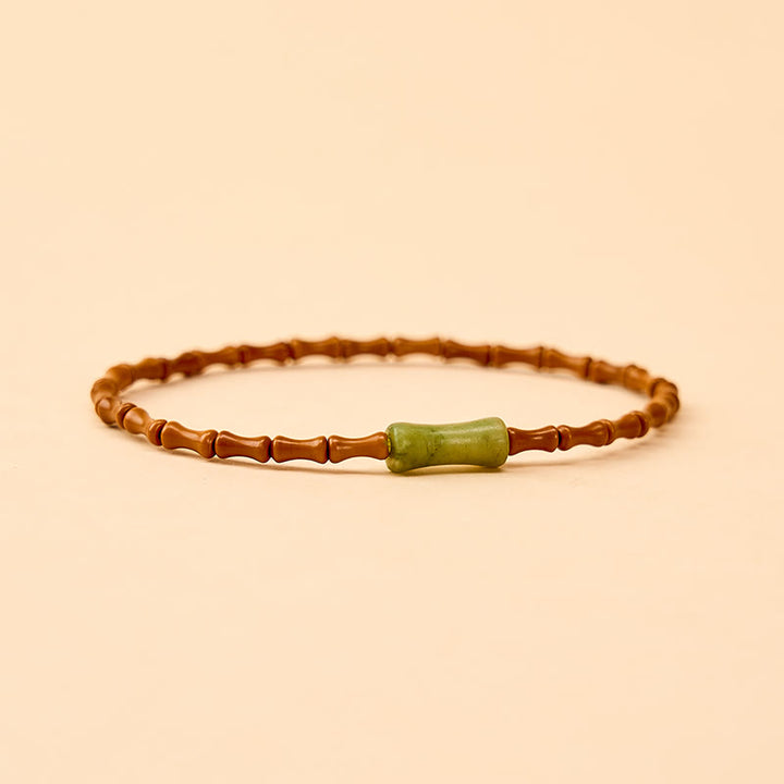 Buddha Stones Armband aus natürlichem Olivenkern, Peridot und Bambus im Schutzdesign - image 4