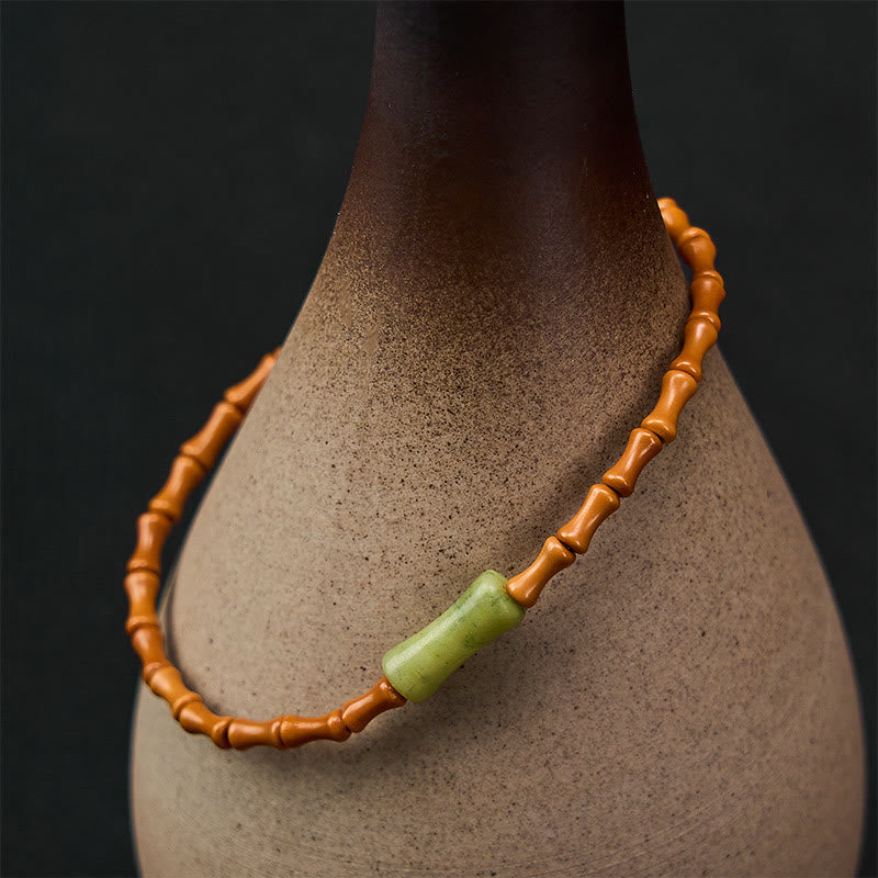 Buddha Stones Armband aus natürlichem Olivenkern, Peridot und Bambus im Schutzdesign - image 1