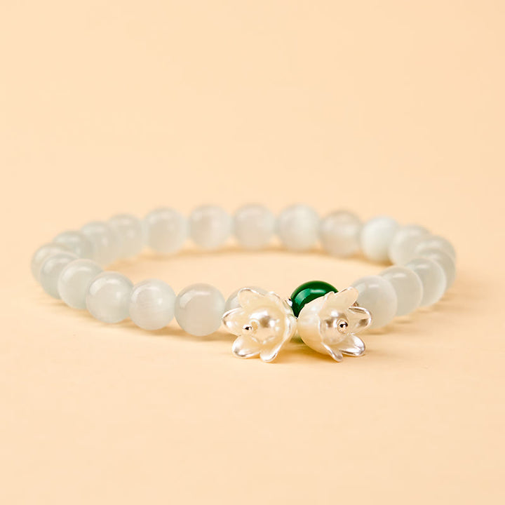 Buddha Stones 8 mm weiße Katzenaugenperlen, rund, Maiglöckchen-Armband - image 1