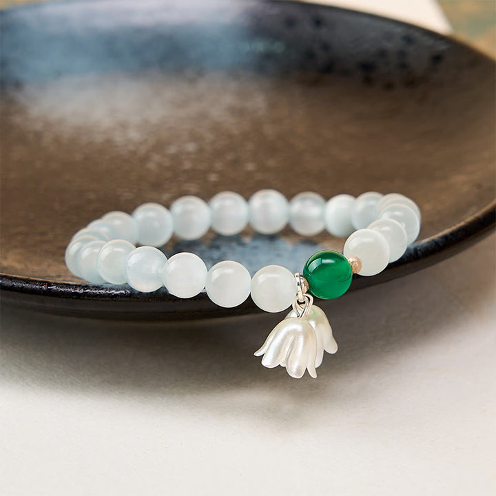Buddha Stones 8 mm weiße Katzenaugenperlen, rund, Maiglöckchen-Armband - image 3