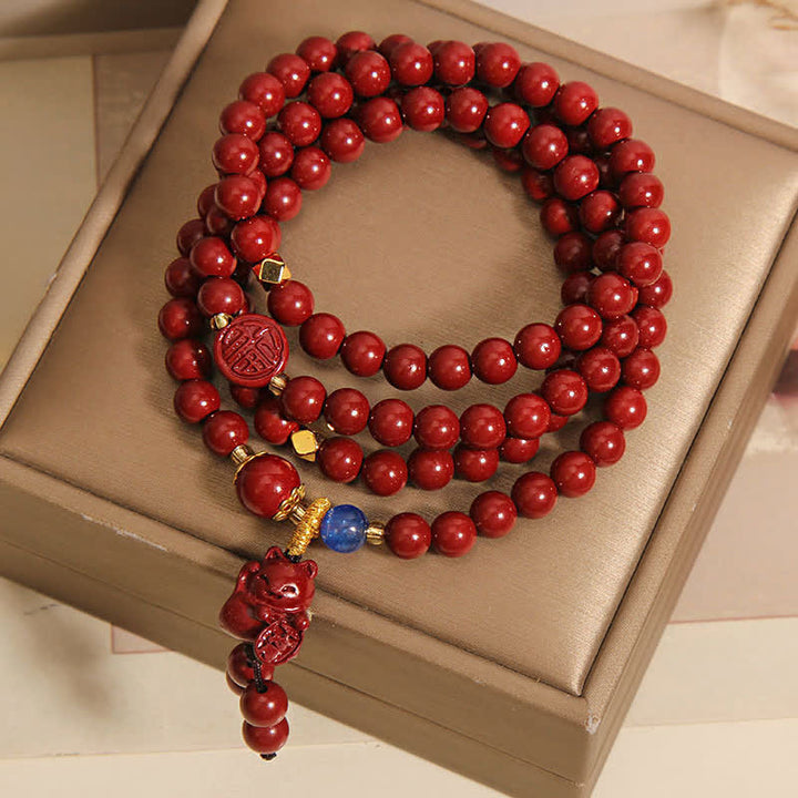 Buddha Stones Tibetische Glücks-Mala mit 108 Perlen aus Zinnober und Katzenmotiv - image 1