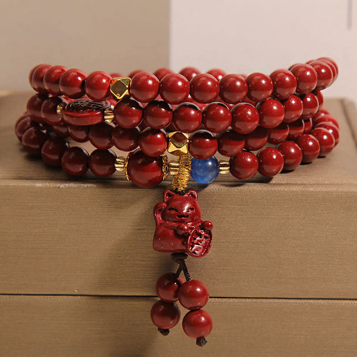 Buddha Stones Tibetische Glücks-Mala mit 108 Perlen aus Zinnober und Katzenmotiv - Zinnober (Handgelenkumfang: 16-18 cm) - image 0