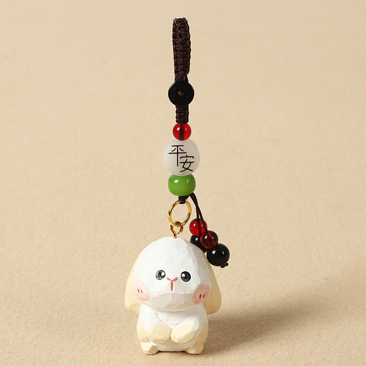 Buddha Stones Chinesischer Tierkreiszeichen-Schlüsselanhänger aus Lindenholz mit gravierter Pflaumenblüte – Frieden, Sicherheit, Om, Mani, Padme, Hum, Positiv - Kaninchen 4 cm (Farbe, Form und Größe können variieren) - Frieden und Sicherheit - image 18