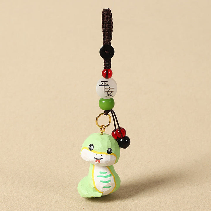 Buddha Stones Chinesischer Tierkreiszeichen-Schlüsselanhänger aus Lindenholz mit gravierter Pflaumenblüte – Frieden, Sicherheit, Om, Mani, Padme, Hum, Positiv - Schlange 4 cm (Farbe, Form und Größe können variieren) - Frieden und Sicherheit - image 25