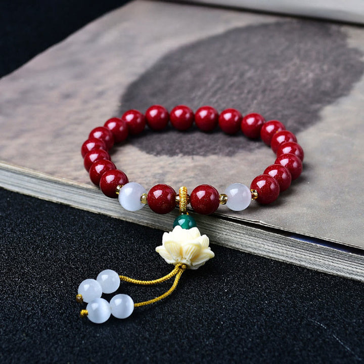 Buddha Stones Natürliches Armband mit Zinnober, Katzenaugen-Elfenbein, Lotus-Fruchtanhänger und Segenssymbol - 8 mm Zinnober (Handgelenkumfang: 15–16 cm) - image 0