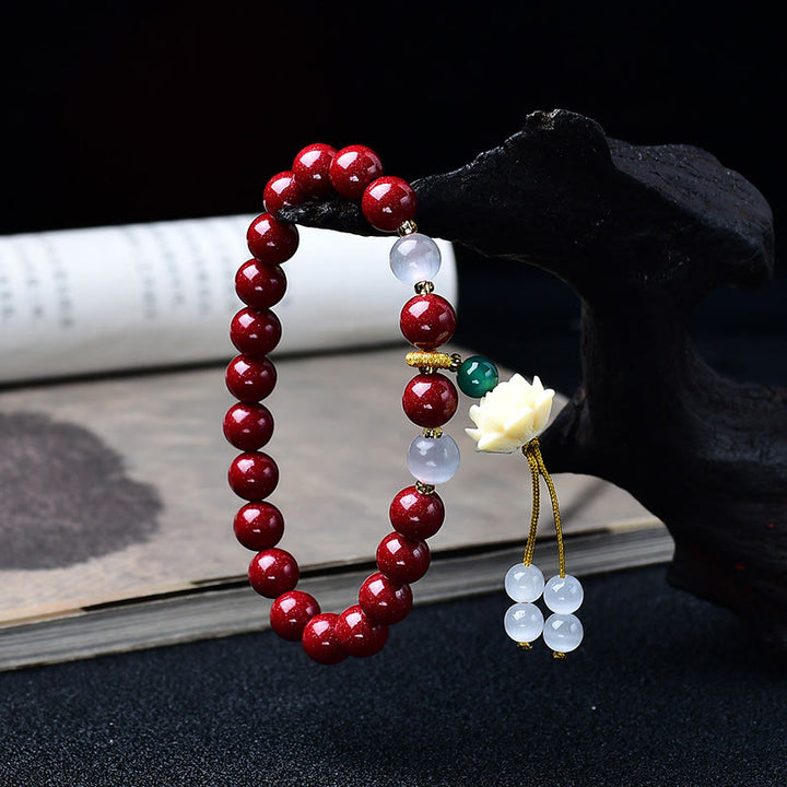 Buddha Stones Natürliches Armband mit Zinnober, Katzenaugen-Elfenbein, Lotus-Fruchtanhänger und Segenssymbol - image 1