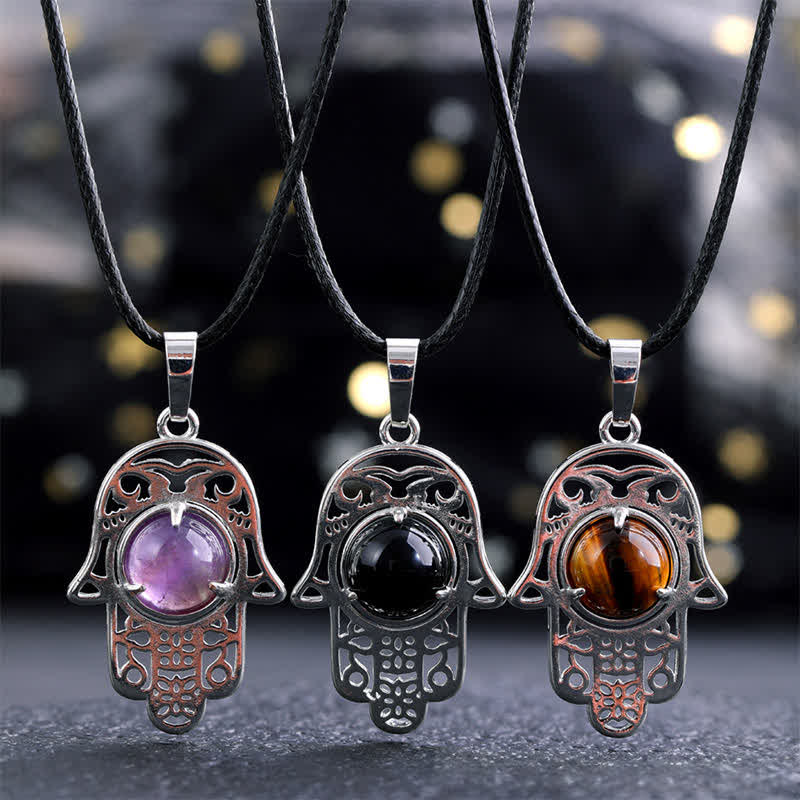 Buddha Stones Halskette aus schwarzem Obsidian mit Hamsa-Palm-Einlage und Kristallstärke - image 0