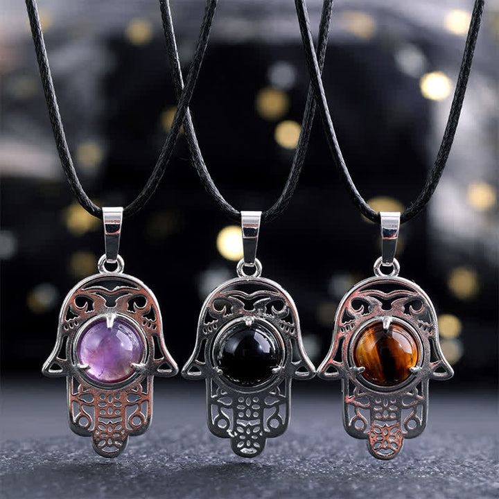 Buddha Stones Halskette aus schwarzem Obsidian mit Hamsa-Palm-Einlage und Kristallstärke - image 0