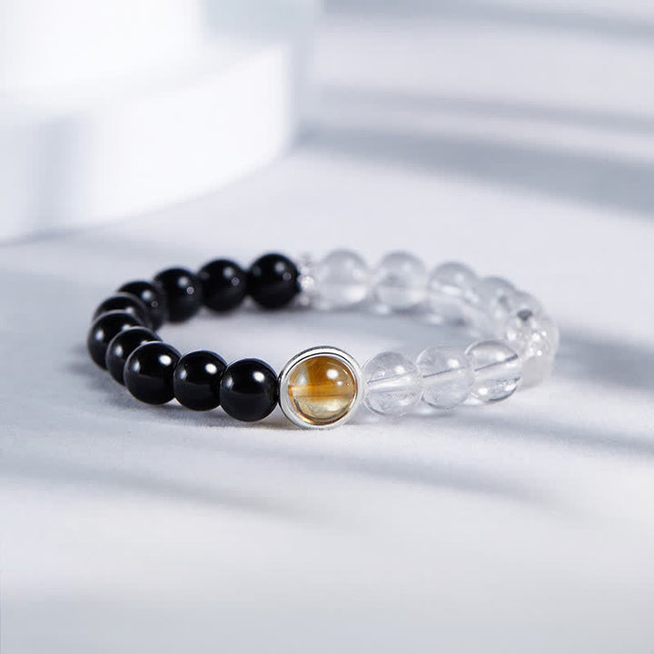 Buddha Stones Schutzarmband aus klarem Quarz und schwarzem Obsidian - Klarer Quarz, schwarzer Obsidian (Handgelenkumfang: 15–16 cm) - image 0
