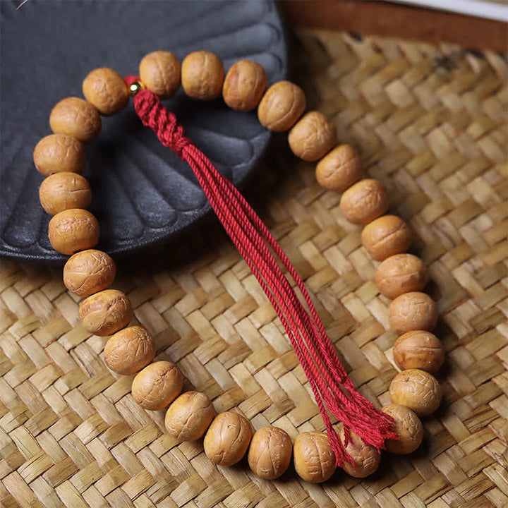 Buddha Stones Phönixauge Bodhi Weisheit Tibetische gravierte Quasten-Armband-Mala - image 1
