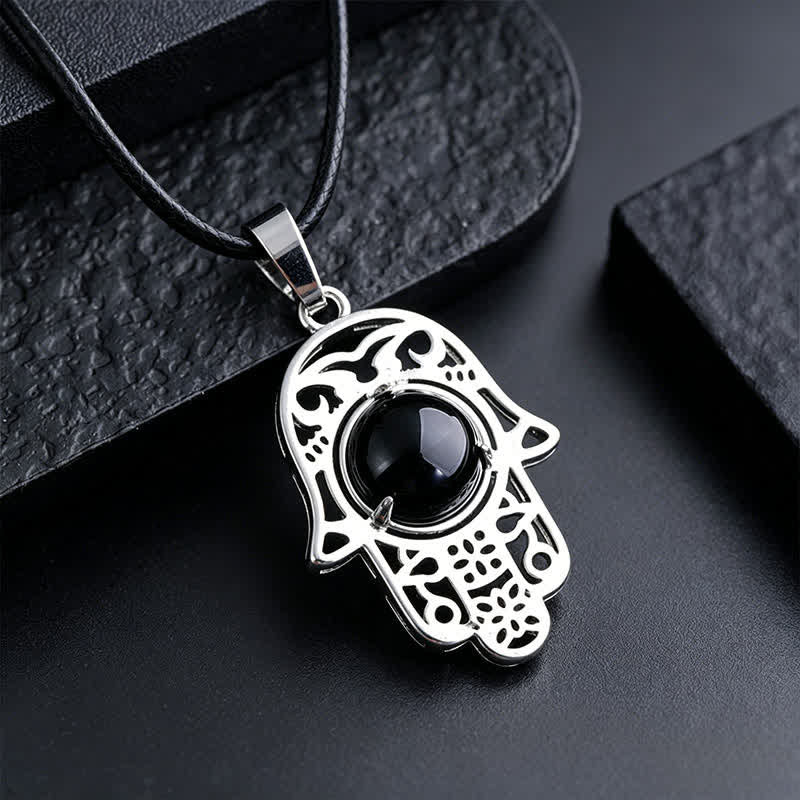 Buddha Stones Halskette aus schwarzem Obsidian mit Hamsa-Palm-Einlage und Kristallstärke - Natürlicher schwarzer Obsidian (Farbe kann variieren) - image 1
