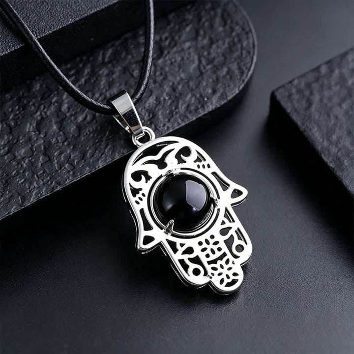 Buddha Stones Halskette aus schwarzem Obsidian mit Hamsa-Palm-Einlage und Kristallstärke - Natürlicher schwarzer Obsidian (Farbe kann variieren) - image 1