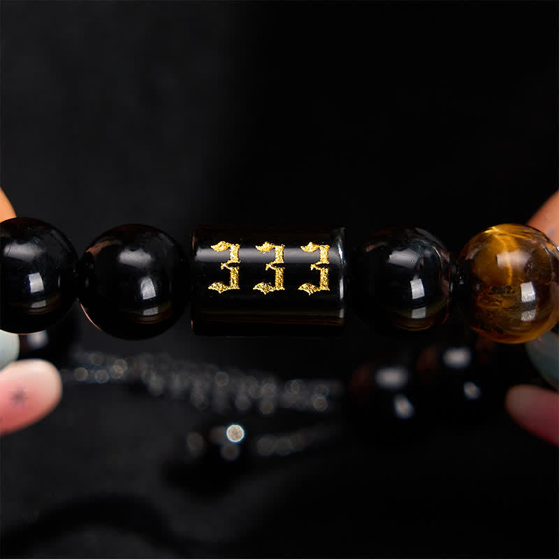Buddha Stones Armband aus natürlichem schwarzem Obsidian und Tigerauge – Symbol für Stärke und Erfüllung - image 1