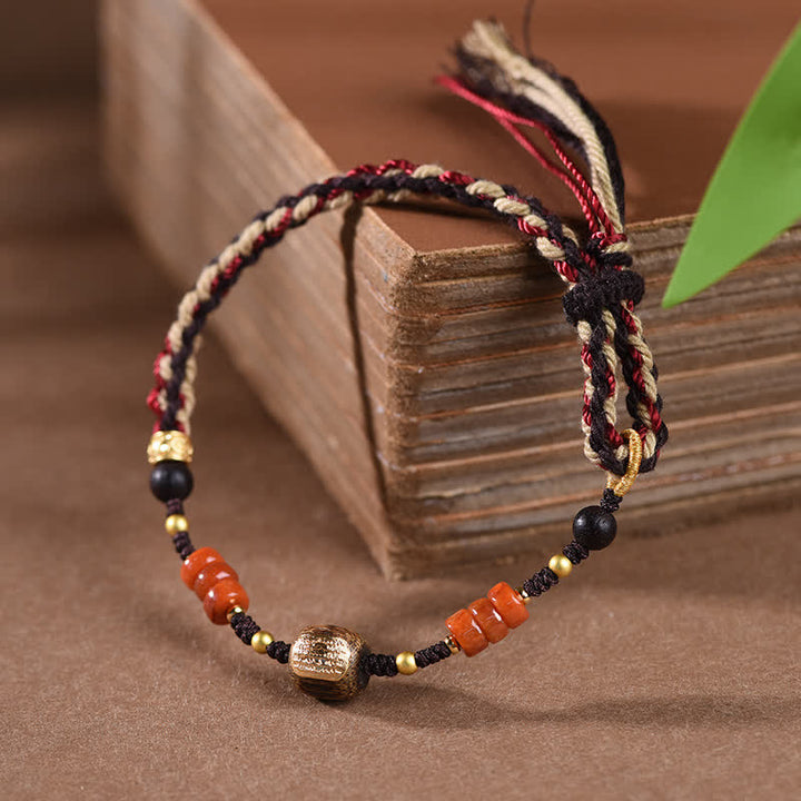 Buddha Stones Handgewebtes Armband aus rotem Sandelholz mit geflochtenen Quasten und Segensbotschaft - image 1