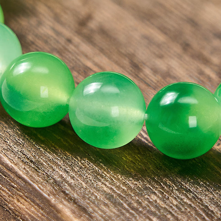 Buddha Stones Armband aus weißen Chalcedon-Perlen mit heilender grüner, schwebender Blume - image 9
