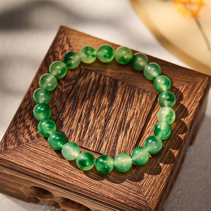 Buddha Stones Armband aus weißen Chalcedon-Perlen mit heilender grüner, schwebender Blume - image 1