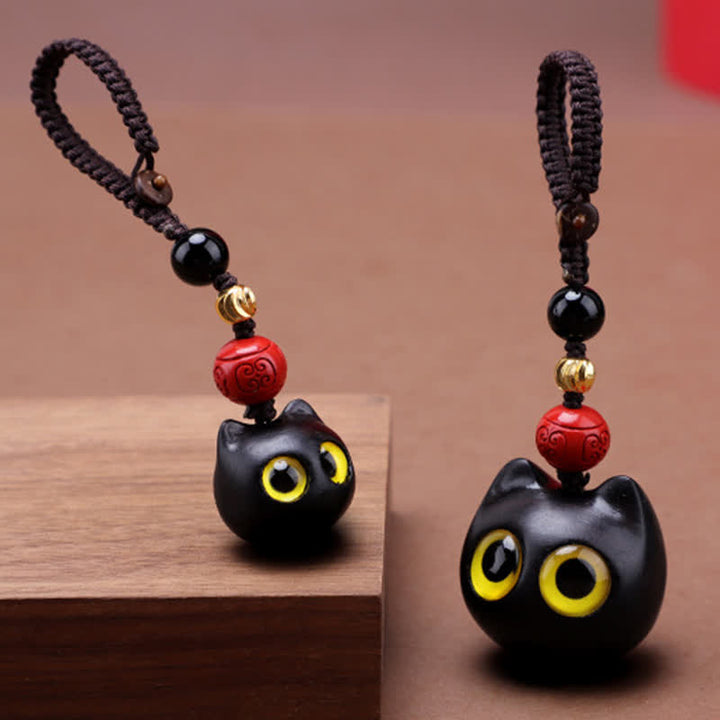 Buddha Stones Niedliche, handgeschnitzte Schlüsselanhänger aus Ebenholz mit Katzenmotiv – ein Symbol für Frieden und Erdung. - image 0