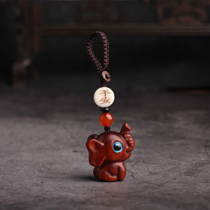 Buddha Stones Schlüsselanhänger aus grünem Sandelholz mit Elefantenmotiv und Stärke-Motiv - Chinesisches rotes Sandelholz - image 9