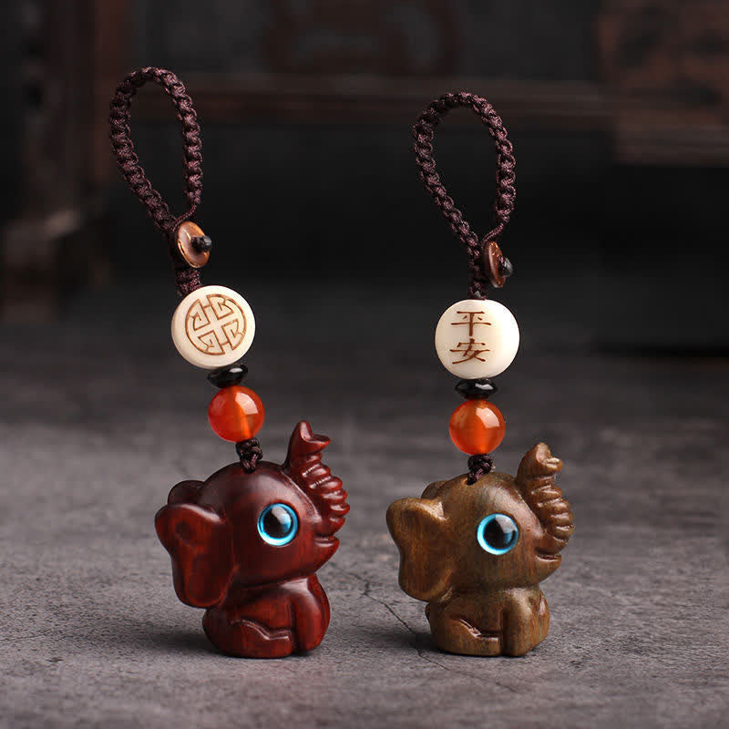Buddha Stones Schlüsselanhänger aus grünem Sandelholz mit Elefantenmotiv und Stärke-Motiv - image 10