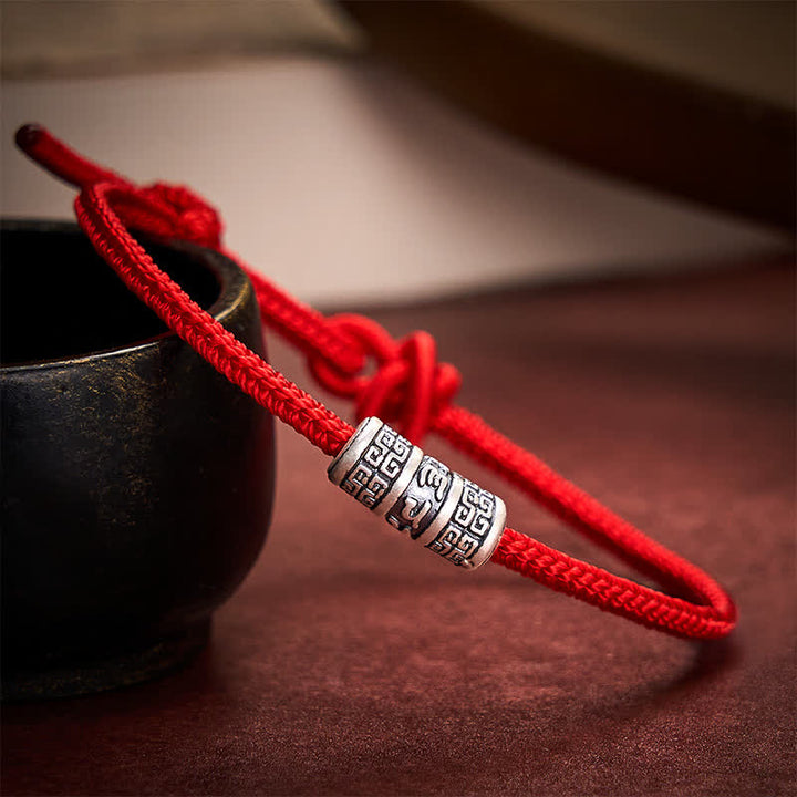 Buddha Stones Handgefertigtes geflochtenes Armband aus roter Schnur mit Om-Mani-Padmé- und Hum-Symbolen zum Schutz - image 1