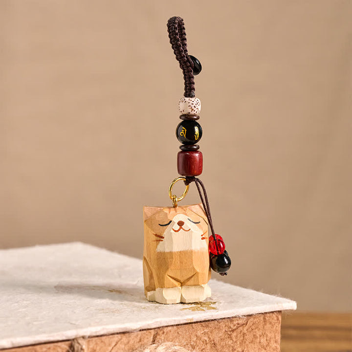 Buddha Stones Handgeschnitzte Schlüsselanhänger aus Holz mit Katzenmotiven und dem Schriftzug „Om Mani Padme Hum Peace“ - image 2