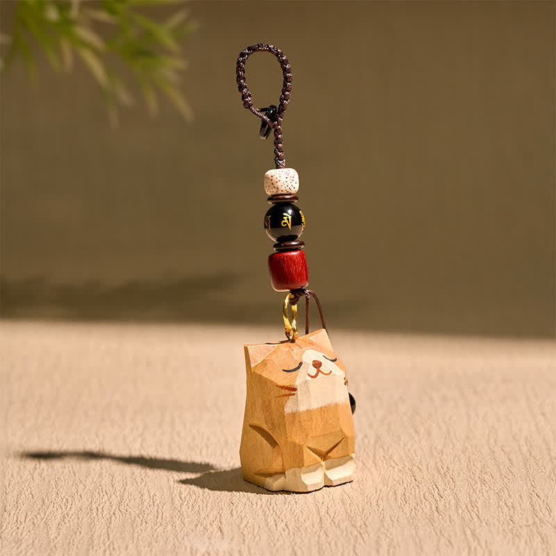 Buddha Stones Handgeschnitzte Schlüsselanhänger aus Holz mit Katzenmotiven und dem Schriftzug „Om Mani Padme Hum Peace“ - image 1