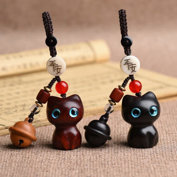 Buddha Stones Handgeschnitzte Schlüsselanhänger mit Katzenglocke aus Ebenholz und rotem Sandelholz - image 0