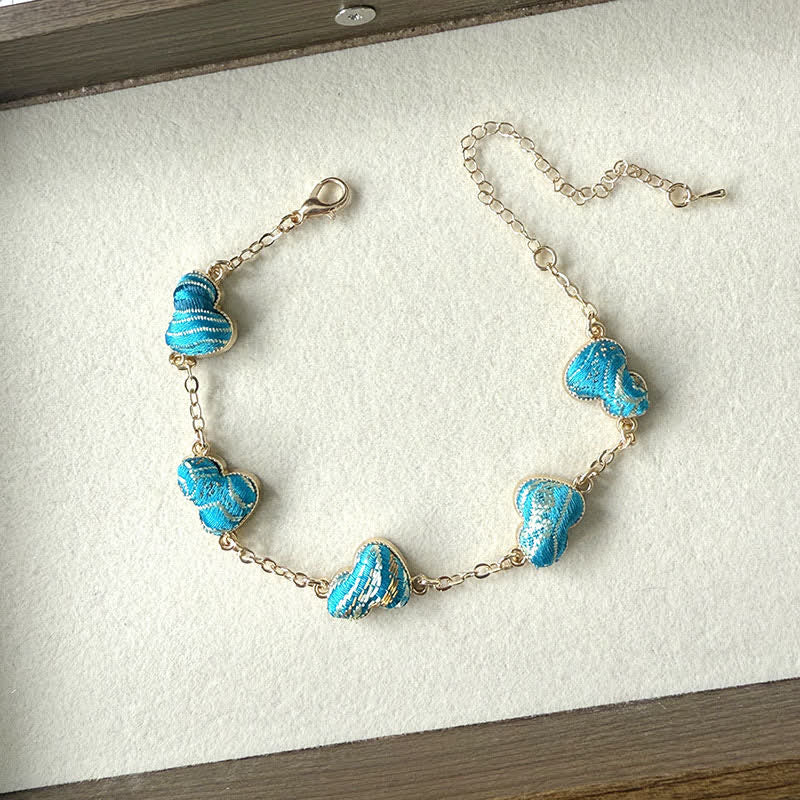 Buddha Stones Armband aus Brokat, Kupferkürbis und Goldton mit Segensmotiv - Blau (gleicher Farbton – Muster variiert) - image 3