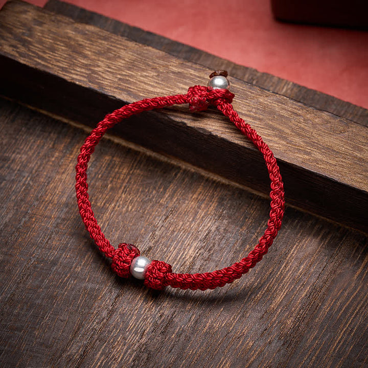 Buddha Stones Armband aus 925er Sterlingsilber mit roter Schnur und Segensbotschaft - image 1