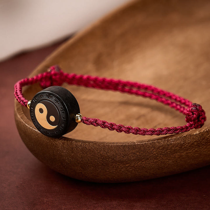 Buddha Stones Armband aus Ebenholz mit Bagua-Symbol und roter Schnur - image 0