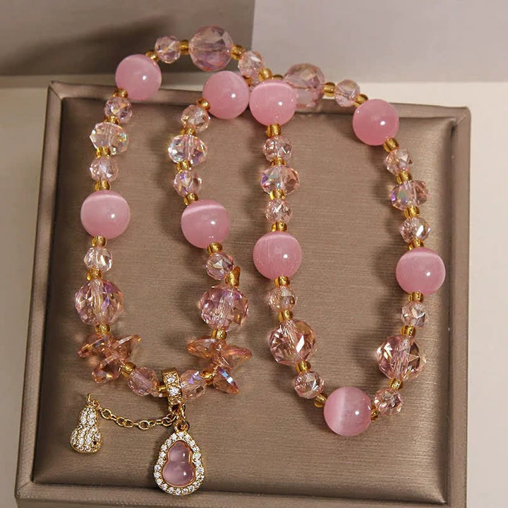 Buddha Stones Doppellagiges Perlenarmband mit Katzenaugenkürbis-Anhänger - image 2