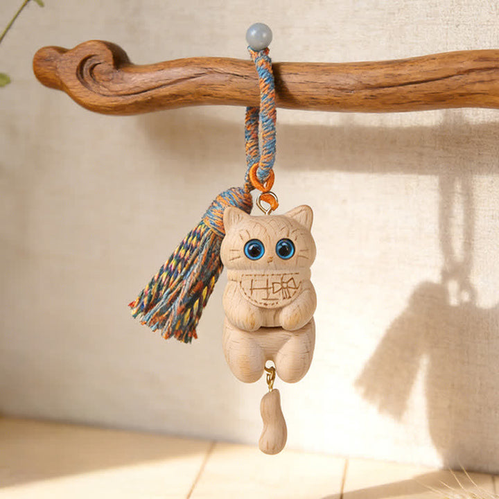 Buddha Stones Schlüsselanhänger mit Katzenquaste aus geschnitztem Naturholz, schlichtes Design - Blau - image 0