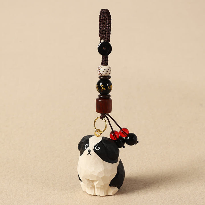 Buddha Stones Schlüsselanhänger mit geschnitztem Hund aus Holz und der Weisheit Om Mani Padme Hum - Om Mani Padme Hum Schwarzer und weißer Hund - image 2