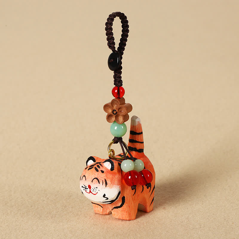 Buddha Stones Schlüsselanhänger aus geschnitztem Holz: Tiger, Om, Mani, Padme, Hum, Fokus - Tiger - image 0