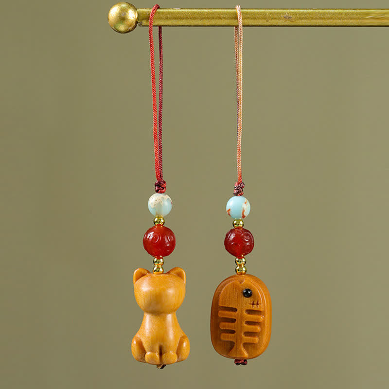 Buddha Stones Handgeschnitzte Schlüsselanhänger aus Sandelholz mit Welsmotiv zur Reinigung - image 0