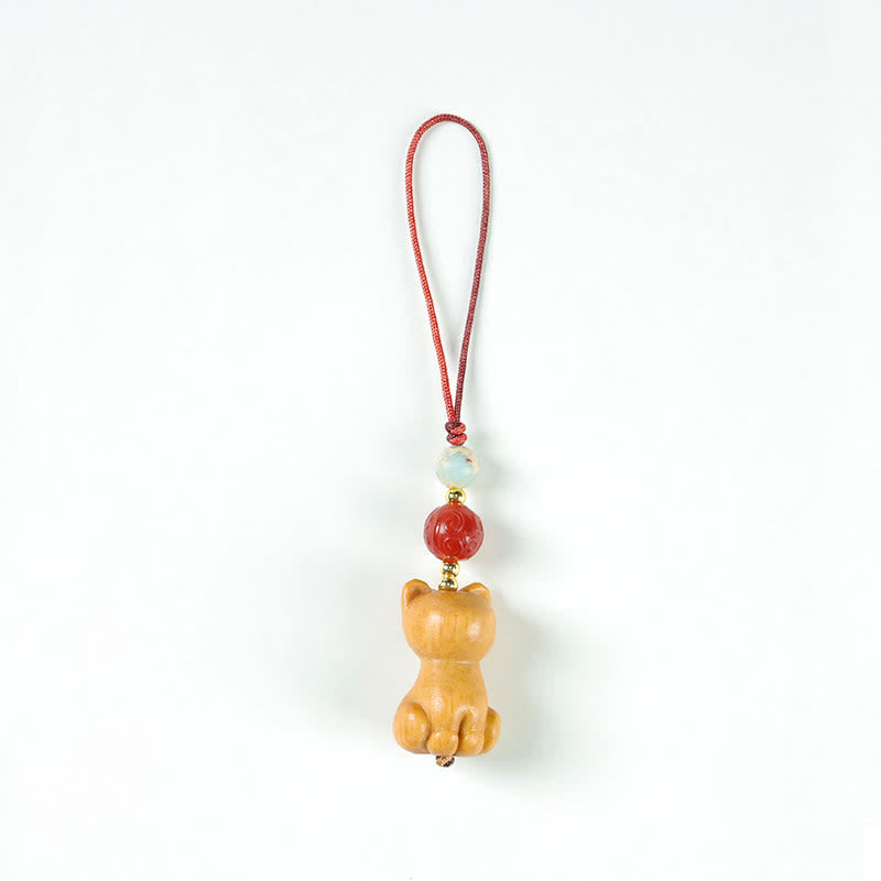 Buddha Stones Handgeschnitzte Schlüsselanhänger aus Sandelholz mit Welsmotiv zur Reinigung - Katze - image 1