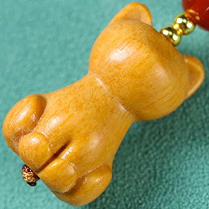 Buddha Stones Handgeschnitzte Schlüsselanhänger aus Sandelholz mit Welsmotiv zur Reinigung - image 3