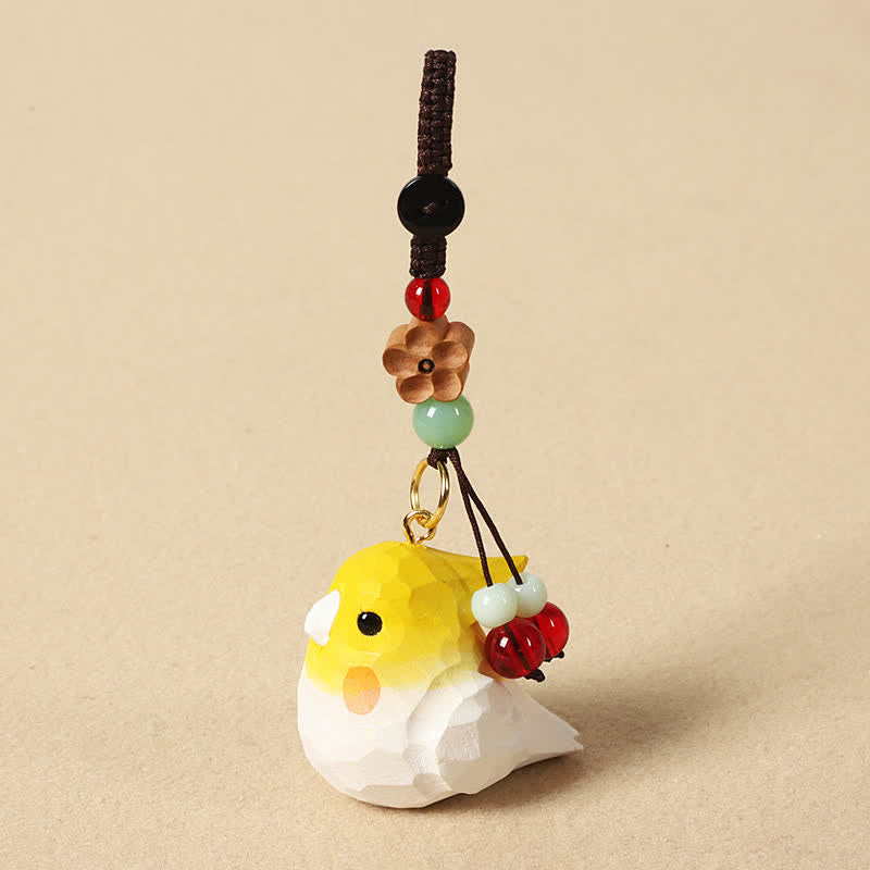 Buddha Stones Handgeschnitzte Schlüsselanhänger aus Naturholz mit Nymphensittichmotiv und den Aufschriften „Om Mani Padme Hum Focus“ - Nymphensittich-Pflaumenblüte - image 1